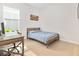 Bright bedroom with a wooden bed frame, desk and large window for natural light at 6304 Chadderton Circle, Myrtle Beach, SC 29579