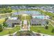 Aerial view of a community clubhouse, pool, and recreational area, surrounded by beautifully landscaped grounds at 6304 Chadderton Circle, Myrtle Beach, SC 29579