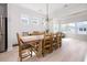 Spacious dining room with a large wooden table and abundant natural light at 6304 Chadderton Circle, Myrtle Beach, SC 29579