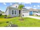 Beautiful home featuring a well-manicured lawn and palm trees at 6304 Chadderton Circle, Myrtle Beach, SC 29579