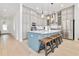 Modern kitchen with stainless steel appliances, stylish cabinets, quartz countertops, and a breakfast bar with seating at 6304 Chadderton Circle, Myrtle Beach, SC 29579