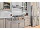 Kitchen featuring stainless steel appliances, custom cabinetry, modern backsplash, and professional range at 6304 Chadderton Circle, Myrtle Beach, SC 29579