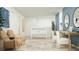 Bright living room features a table-tennis, seating and a work-from-home setup at 6319 Swainson Street Sw, Ocean Isle Beach, NC 28469