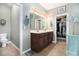 Spacious bathroom features a double sink vanity and adjacent walk-in closet at 632 Lafayette Park Dr., Little River, SC 29566