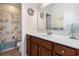 A clean bathroom featuring a vanity with a white countertop and decorative seashell-themed accents at 632 Lafayette Park Dr., Little River, SC 29566