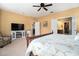Bright bedroom with a fireplace, TV, en-suite bathroom, and walk-in closet at 632 Lafayette Park Dr., Little River, SC 29566
