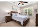 A serene bedroom highlighting a wooden bed frame, neutral walls, and natural light from the window at 632 Lafayette Park Dr., Little River, SC 29566