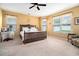 Spacious bedroom with natural light, neutral carpet and a large cozy bed at 632 Lafayette Park Dr., Little River, SC 29566