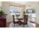 Bright dining area with glass table, decorative chairs, and lots of natural light at 632 Lafayette Park Dr., Little River, SC 29566