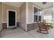 Cozy front porch with two rocking chairs perfect for relaxing and enjoying the neighborhood at 632 Lafayette Park Dr., Little River, SC 29566