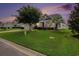 Charming single-story home featuring lush green lawn, mature trees, and vinyl siding at 632 Lafayette Park Dr., Little River, SC 29566