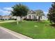 Charming single-story home featuring lush green lawn, mature trees, and vinyl siding at 632 Lafayette Park Dr., Little River, SC 29566