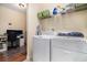 A convenient laundry room with modern washer, dryer, and adjacent workspace for added functionality at 632 Lafayette Park Dr., Little River, SC 29566