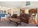 Comfortable open living room with hardwood floors, plush seating, and bright lighting at 632 Lafayette Park Dr., Little River, SC 29566
