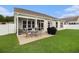 This home includes a screened in patio with an outdoor dining set, perfect for enjoying the weather outdoors at 632 Lafayette Park Dr., Little River, SC 29566