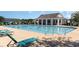 Outdoor community pool with plenty of lounge chairs on the deck at 632 Lafayette Park Dr., Little River, SC 29566