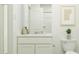 Clean and modern bathroom with a vanity, toilet, and shower/tub combination at 6335 Swainson Street Sw, Ocean Isle Beach, NC 28469