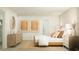 Bright bedroom featuring light wood furniture, neutral tones, and minimalist decor at 6335 Swainson Street Sw, Ocean Isle Beach, NC 28469