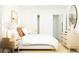Well-lit bedroom with light wood furniture, neutral decor, and ample closet space at 6335 Swainson Street Sw, Ocean Isle Beach, NC 28469