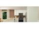 Modern kitchen featuring white cabinets, stainless steel appliances, and an open layout at 6335 Swainson Street Sw, Ocean Isle Beach, NC 28469