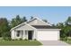 Charming single-story home with gray siding, white trim, and a well-manicured lawn showcasing modern curb appeal at 6366 Swainson Street Sw, Ocean Isle Beach, NC 28469