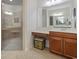 Bathroom featuring double mirrors and an upgraded walk-in shower at 637 Grand Cypress Way, Murrells Inlet, SC 29576