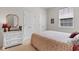 Bedroom with neutral colored walls and carpet, a white dresser, and a side window at 637 Grand Cypress Way, Murrells Inlet, SC 29576