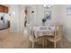 Dining room with white wood chairs and white linens at 637 Grand Cypress Way, Murrells Inlet, SC 29576