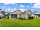 Charming home with a well-manicured lawn and a screened-in porch at 637 Grand Cypress Way, Murrells Inlet, SC 29576