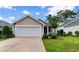 Charming single-story home with a well-manicured lawn and a two-car garage in a lovely neighborhood at 637 Grand Cypress Way, Murrells Inlet, SC 29576