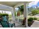 Inviting front porch with comfortable seating and a view of the landscaped yard at 637 Grand Cypress Way, Murrells Inlet, SC 29576