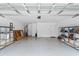 Spacious garage with overhead lighting, a water heater and shelving units for storage at 637 Grand Cypress Way, Murrells Inlet, SC 29576