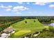 Aerial view of the golf course and club house at 637 Grand Cypress Way, Murrells Inlet, SC 29576