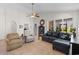 Bright living room offers comfortable seating and a view of the backyard at 637 Grand Cypress Way, Murrells Inlet, SC 29576
