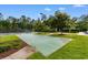Enjoy a friendly game on the community's shuffleboard court, surrounded by manicured landscaping and lush greenery at 637 Grand Cypress Way, Murrells Inlet, SC 29576