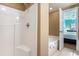 Clean bathroom with separate shower and tub with view into the bedroom at 704 S Ocean Blvd. # 304A, Myrtle Beach, SC 29577