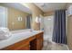 Lovely bathroom featuring a shower/tub combination with ample lighting and soft fluffy towels at 704 S Ocean Blvd. # 304A, Myrtle Beach, SC 29577