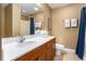 Well-lit bathroom features a spacious countertop, neutral tiling, and soft towels for a spa-like experience at 704 S Ocean Blvd. # 304A, Myrtle Beach, SC 29577