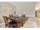 Cozy dining area with a wooden table, seating for four, and coastal-themed decor at 704 S Ocean Blvd. # 304A, Myrtle Beach, SC 29577