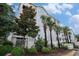 Well-manicured lawn and landscaping give a welcoming feel to the building at 704 S Ocean Blvd. # 304A, Myrtle Beach, SC 29577
