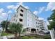 Exterior shot of building with covered parking and views from condos at 704 S Ocean Blvd. # 304A, Myrtle Beach, SC 29577
