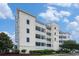 Three story condo with balconies and manicured landscaping with plenty of curb appeal at 704 S Ocean Blvd. # 304A, Myrtle Beach, SC 29577