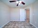 Neutral bedroom with tile flooring, a ceiling fan, and a doorway leading to another room at 708 Shenanigan Loop, Murrells Inlet, SC 29576