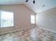 Cozy bedroom with vaulted ceilings and two windows offering ample natural light at 708 Shenanigan Loop, Murrells Inlet, SC 29576
