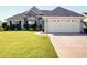 Charming home featuring a well-manicured lawn and attached two-car garage in a desirable neighborhood at 708 Shenanigan Loop, Murrells Inlet, SC 29576