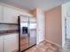 Modern kitchen with stainless steel refrigerator and abundant cabinet space at 708 Shenanigan Loop, Murrells Inlet, SC 29576