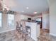 Updated kitchen features white cabinets, granite countertops, and stainless steel appliances at 708 Shenanigan Loop, Murrells Inlet, SC 29576