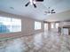 Expansive living room with vaulted ceilings, multiple windows, and seamless flow into the kitchen area at 708 Shenanigan Loop, Murrells Inlet, SC 29576