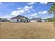 Expansive backyard featuring a covered patio, perfect for outdoor entertaining and relaxation at 729 Jade Dr., Myrtle Beach, SC 29579