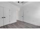 Clean bedroom with grey flooring, white trim, closet doors and bright natural light at 729 Jade Dr., Myrtle Beach, SC 29579